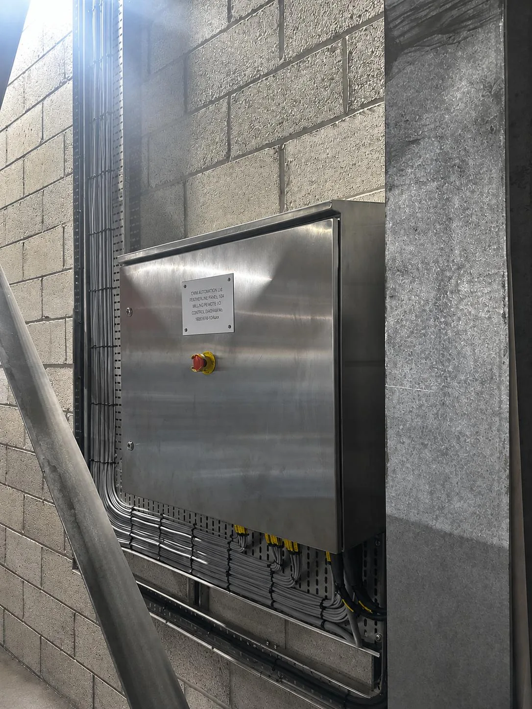 Remote I/O panel and its containment entries feeding field signals back to the site PLC