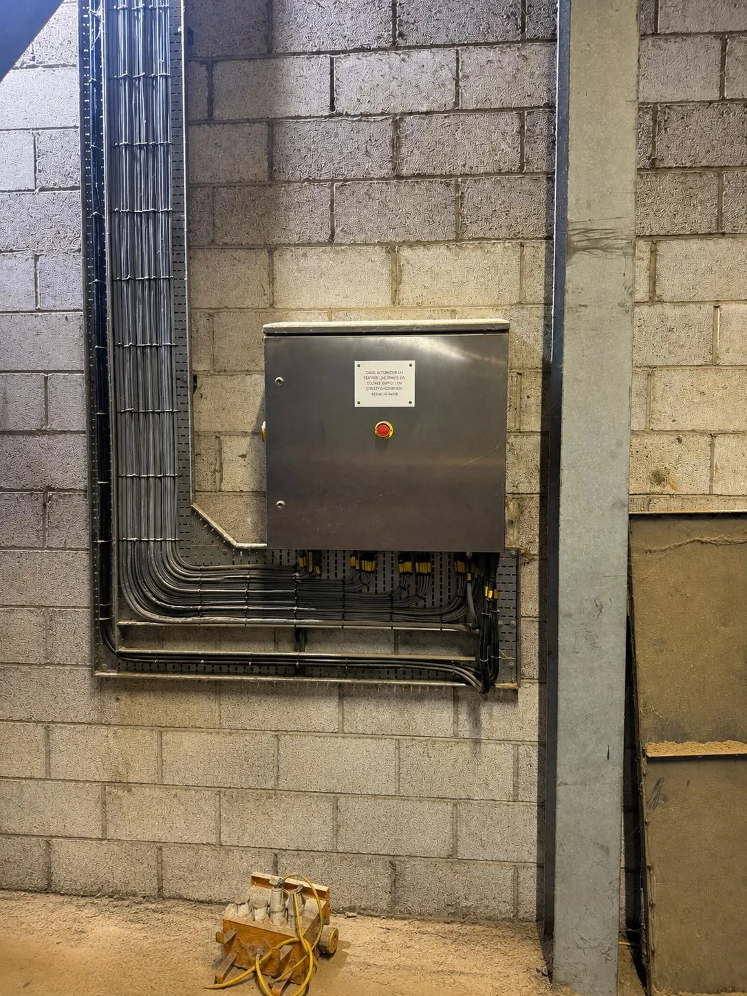 Stainless steel remote I/O panel mounted adjacent to the grinding process