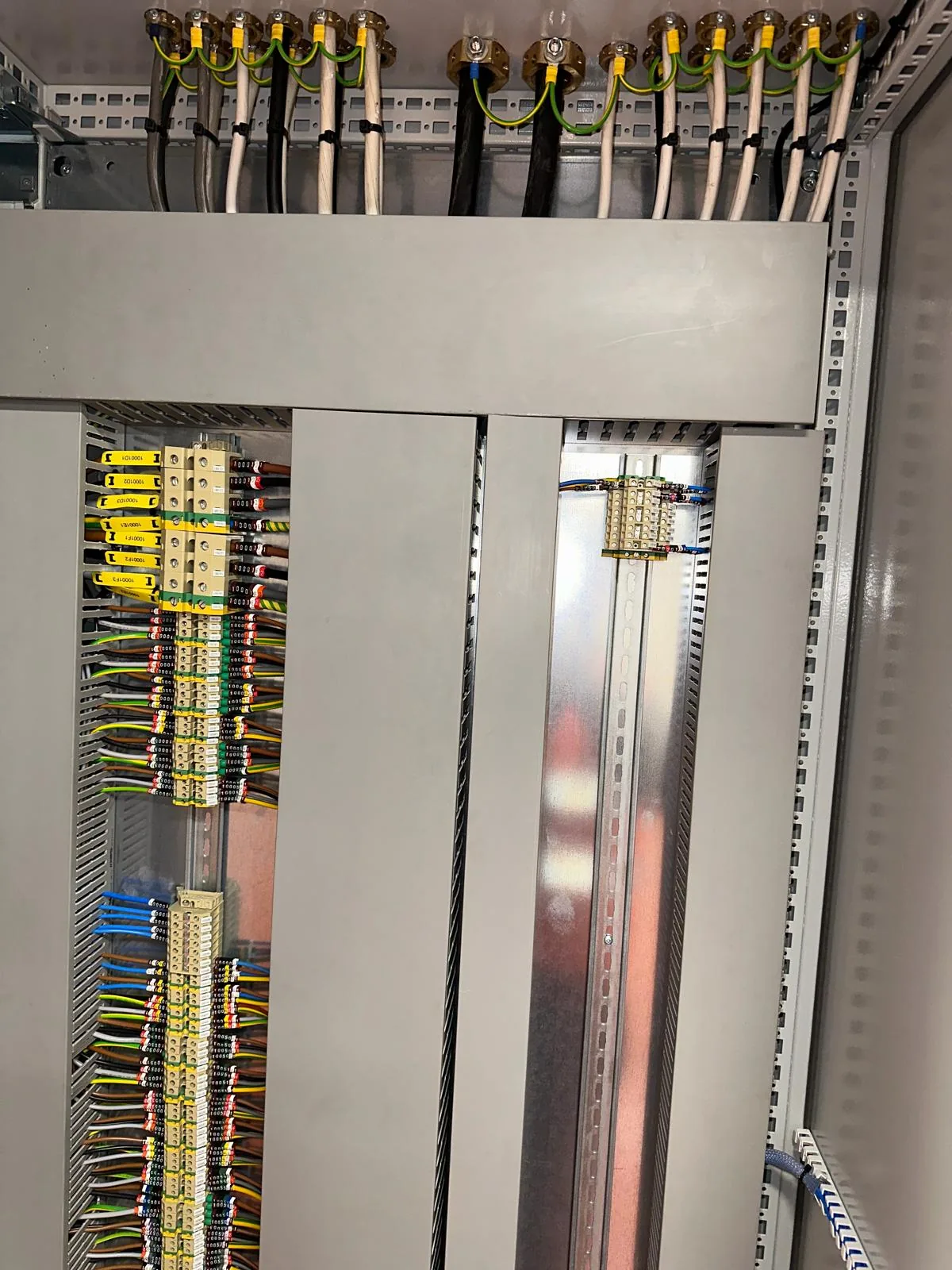 Terminal rails and control wiring inside the grinding plant motor control panel